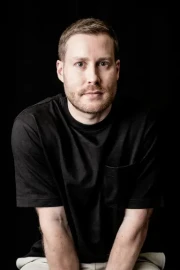 Experienced businessman smiling in a modern office