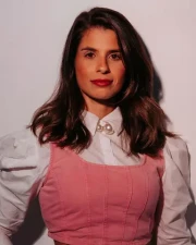 Casual man with a beard wearing a black t-shirt in a relaxed pose