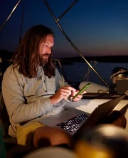 Musician performing on a guitar in a creative studio environment