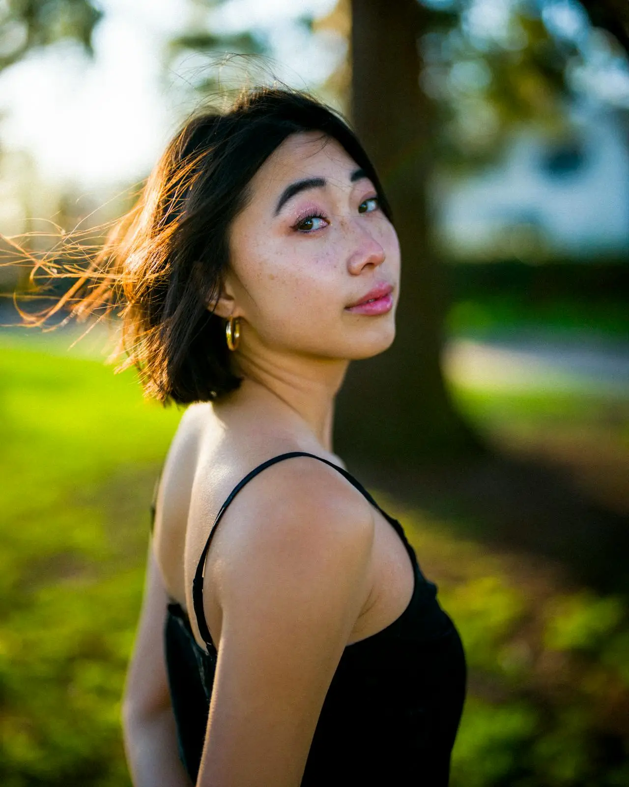 Outdoor portrait of a young woman enjoying nature